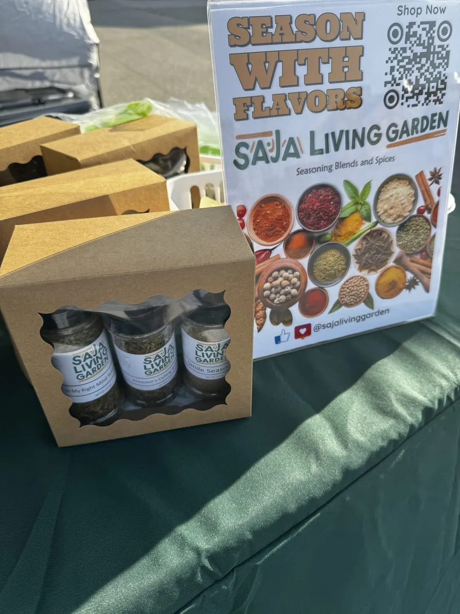 Saja Living Garden gift boxes and a ‘Season With Flavors’ sign at a market table